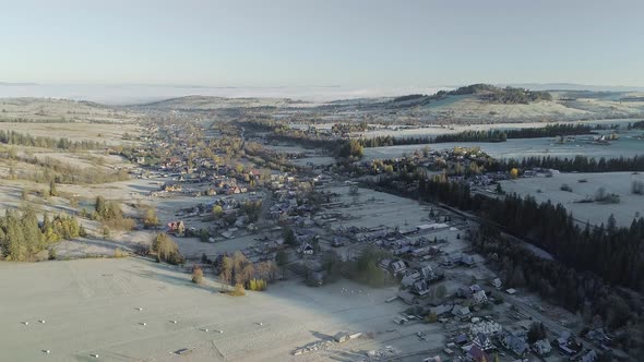 Aerial at dawn of rural village Witow in Southern Poland, scenic landscape alt