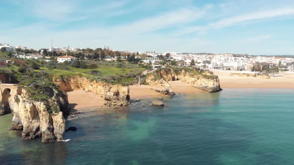 View From Estudante Beach to Farol de Lagos Molhe Este and Lagos Old Townscape, in Algarve alt