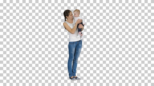 Young mother making an attention gesture while holding her baby alt