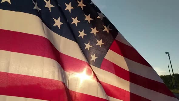 Slow Motion American Flag waving in the golden light of sunrise, fourth of July, Patriotism alt