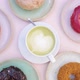Top View of Spinning Image of Matcha Latte Surrounded By Colorful Donuts.  - VideoHive Item for Sale