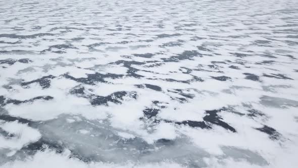 Aerial Drone View Flying High Above Frozen Ice Lake In Winter 2