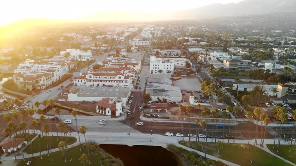 Aerial drone shot over the luxury hotels and expensive homes of downtown State Street during sunset alt
