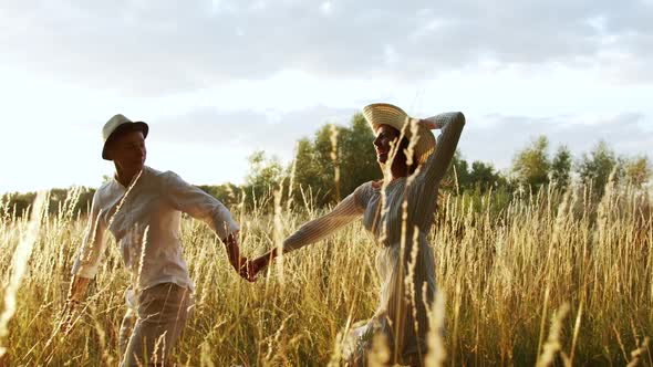 Loving Couple Running in Countryside Park