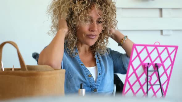 Young adult pretty woman at home in hair care activity - beauty salon indoor house alt