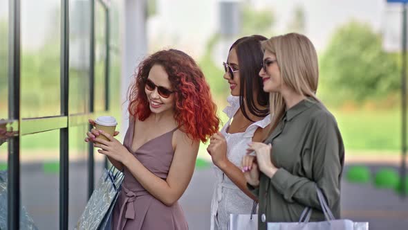 Three Fashionable Woman Friend with Shopping Bag Desired Looking at Glass Window Showcase alt