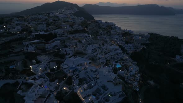 Aerial View Flying Over City of Oia on Santorini Greece alt
