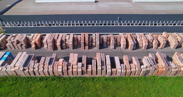 There are Many Pallets Along the Production Building alt