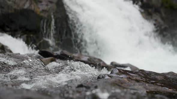 A slow motion tilting shot that reveals Lucia falls in Vancouver, Washington. alt