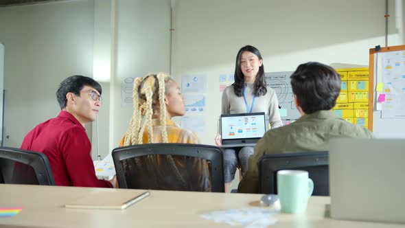 brainstorming about mobile app interface workflow design on table with coworke alt