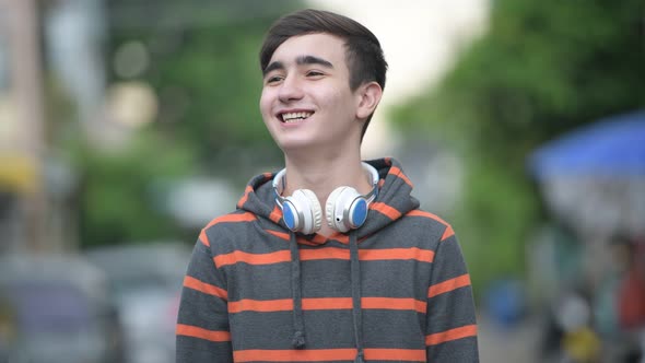 Young Handsome Iranian Teenage Boy in the Streets Outdoors alt