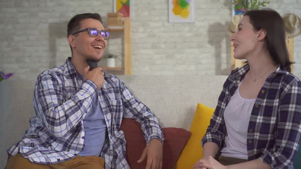 Man Communicates Young Woman Sitting Couch Uses Speech Aid Problems Ligaments alt