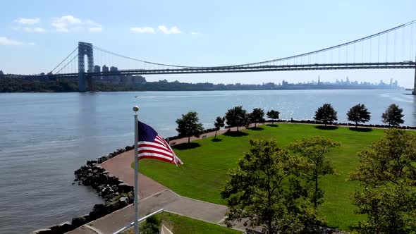 Aerial View of American Flag with George Washington Bridge. alt