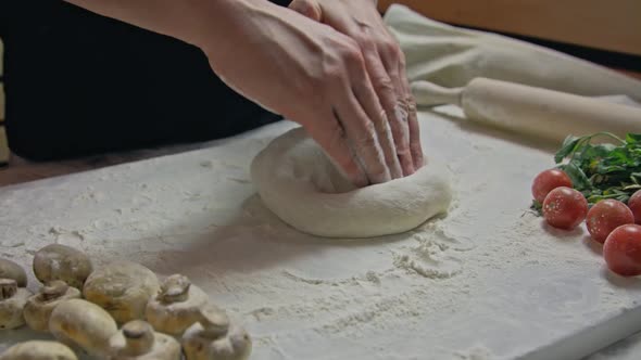 Senior Professional Chef Kneading Floured Dough at Bakery Mature Retiree Enjoying Hobby Making