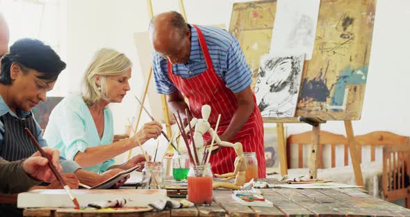 Artists working together at table alt