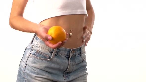 Sporty Woman with Apple in Her Hand, Spinning, on White Background alt