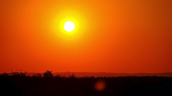 Timelapse Sunset in the Sky Big Bright Yellow Sun Moves Down on the Horizon alt