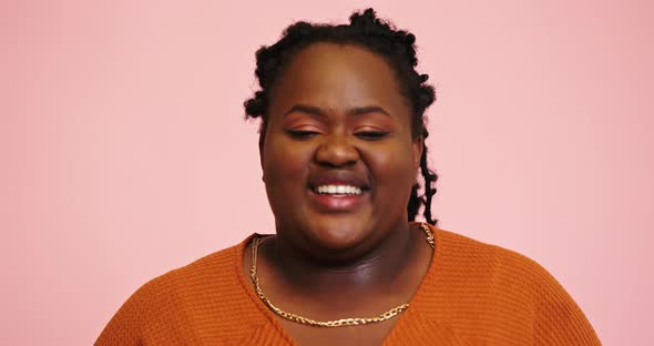 AfroAmerican Model Smiles and Talks Looking Into Camera alt