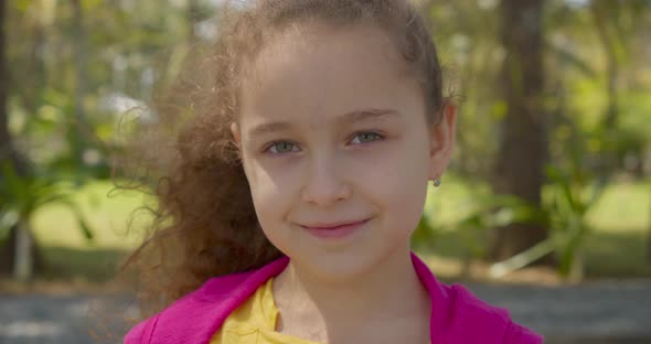 Portrait Cute Kid Child with Pretty Face on Street alt