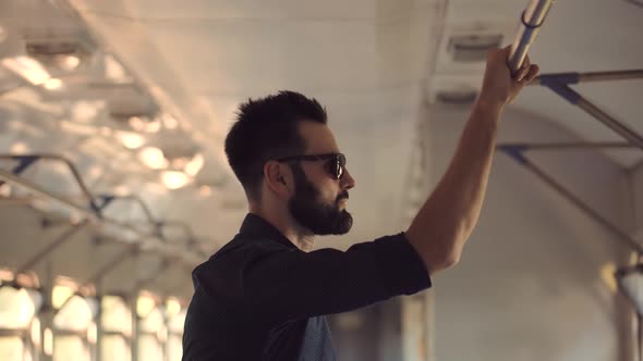 Male Hand With Watch Taken Handrail In Public Transport. Tourist City Travel Journey Trip. alt