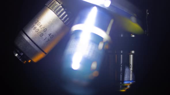 Moving Light Catches The Objectives Of The Microscope And They Shines