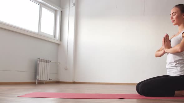 Woman Doing Yoga in Studio.
