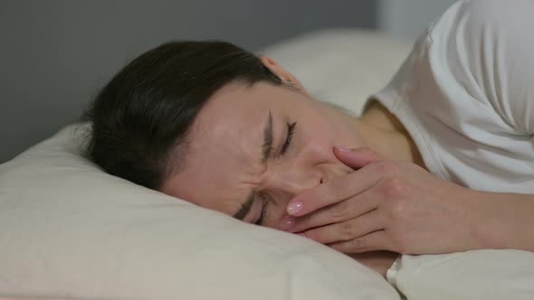 Upset Young Woman Crying in Bed  alt
