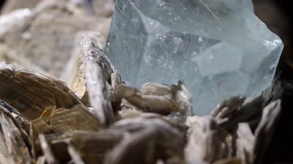 A detail shot of an aquamarine crystal showing the emergence from the matrix of muscovite. Sample fr alt