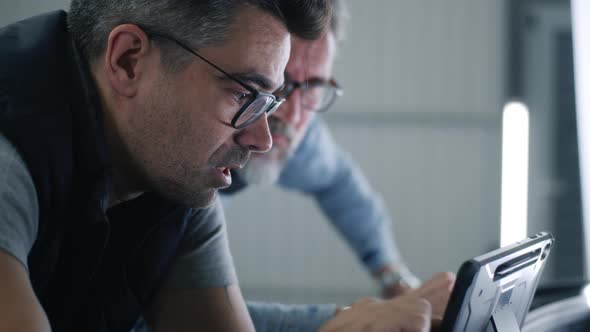 Mechanic and Client During Car Diagnostics alt