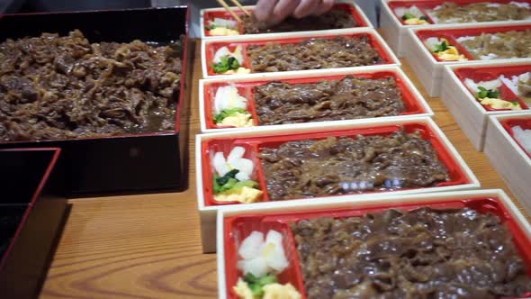 Japanese Chef Cooking And Preparing Food Lunch Box Bento Beef Rice Side Dishes For Sell