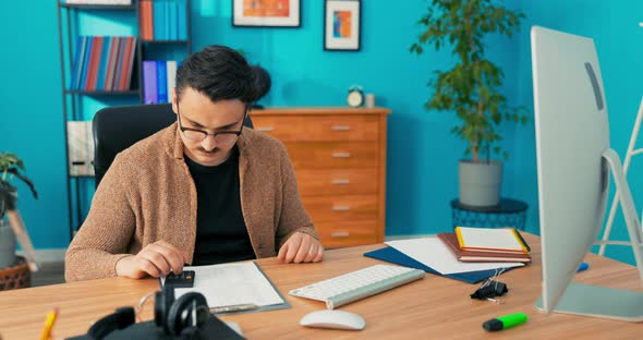 Accountant in Glasses Employee of Company's Accounting Finance Statistics Department Checks Accuracy alt