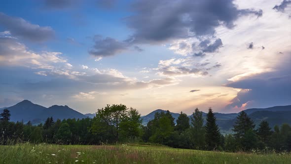 Mountain Landscape in Summer at Sunset Sunbeams From Behind the Clouds