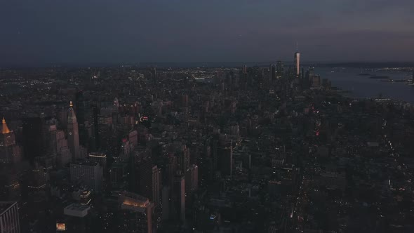 AERIAL: Manhattan Drone Flight at Night with Glowing City Light in New York City  alt