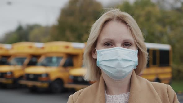 Portrait of a Female Teacher in a Protective Mask alt