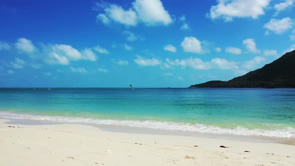 Aerial landscape of paradise coast beach lifestyle by blue water and bright sandy background of a pi alt