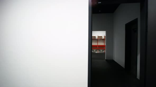 The Camera Flies Through the Doorway in Front of the Sports Locker Room alt