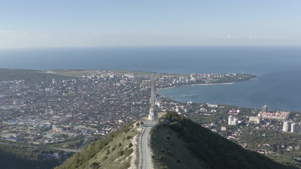 Aerial Panorama View Picturesque Monastery Architecture Cross on Top of High Mountain Sea Landscape alt
