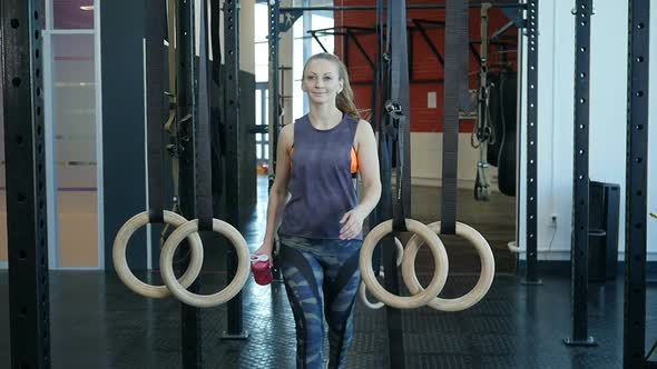 Young Sports Woman Passing at Fitness-Gym. Fit Girl Entering a Fitness Club