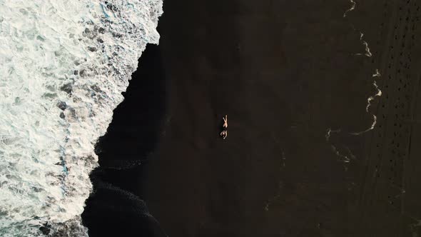 The Girl Was Lying on the Beach From a Bird's Eye View