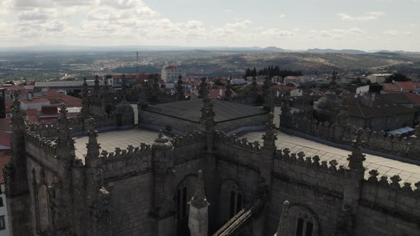 Flying around majestic gothic spires of the Guarda cathedral, Portugal.