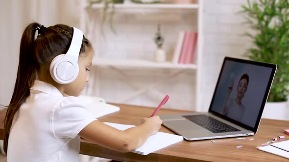 Little Child Girl Using Laptop Computer for Studying Online E-learning System