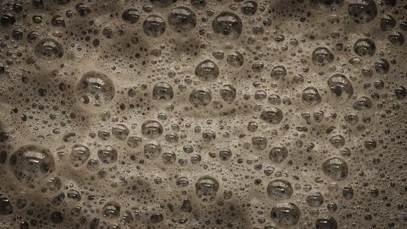 Dark Foam With Bubbles Popping alt