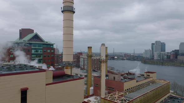 Fly Around Chimneys of Factory on Riverbank alt