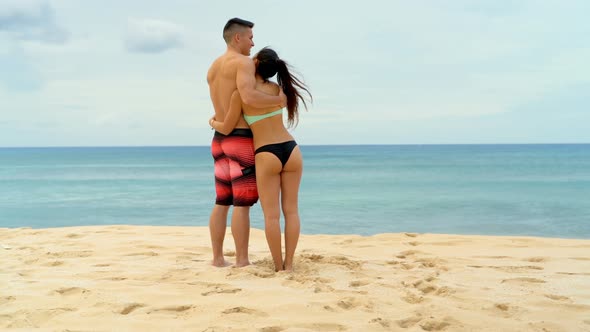 Couple embracing each other on the beach 4k