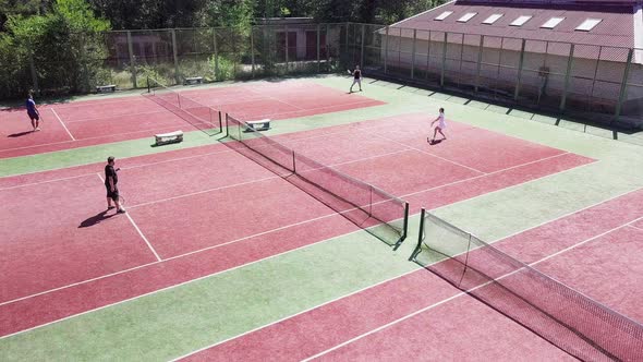 Tennis Players During Match on Court in Summer