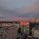 Purple Clouds in Grey Sky Over Cityscape in Golden Hour of Sunset - VideoHive Item for Sale
