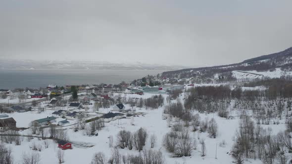 aerial view over Olderdalen, Village in Kåfjord, Norway on a cloudy winter day alt