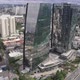 Mirrored two Building and Clouds with cars and river drone 4k - VideoHive Item for Sale