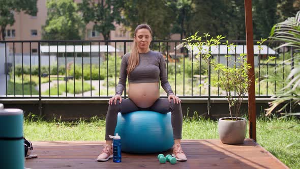 Pregnant woman making breath exercise. Shot with RED helium camera in 8K alt