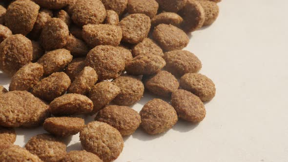 Slow pan on extruded cat or dog food on pile n 4K 2160p 30fps UltraHD panning  footage - Shallow DOF alt